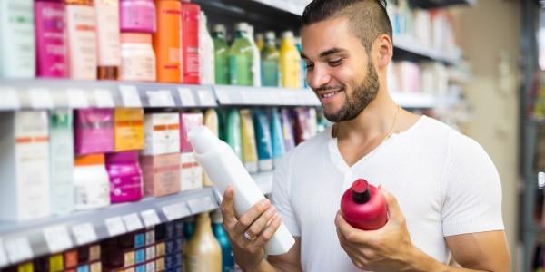 man reading ingredients